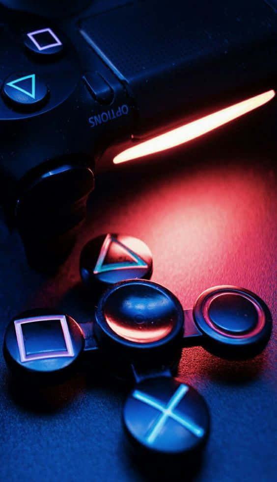 A Red And Blue Controller With A Red Light On It