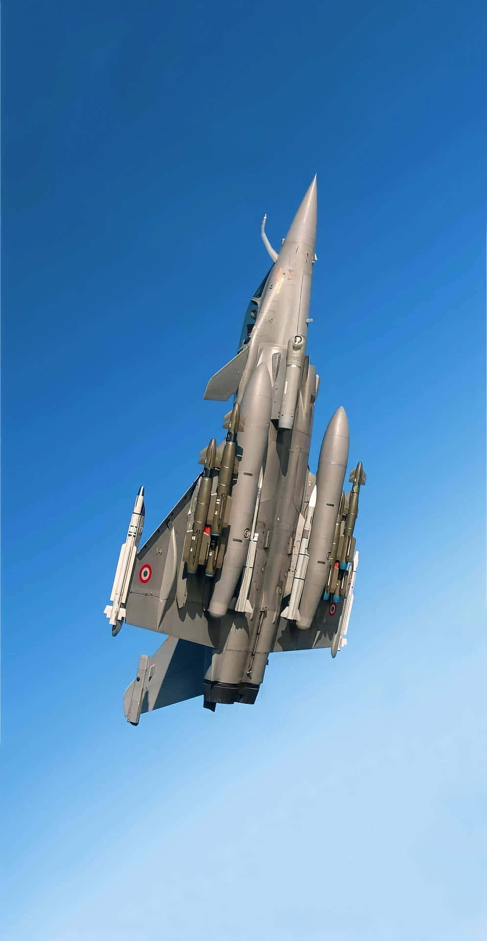 A Military Jet Flying In The Sky