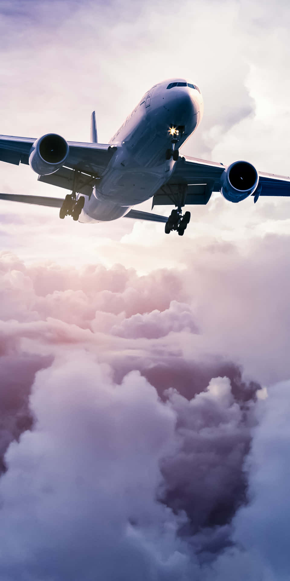 Flugzeug,das Über Den Wolken Schwebt. Android Hintergrundbild
