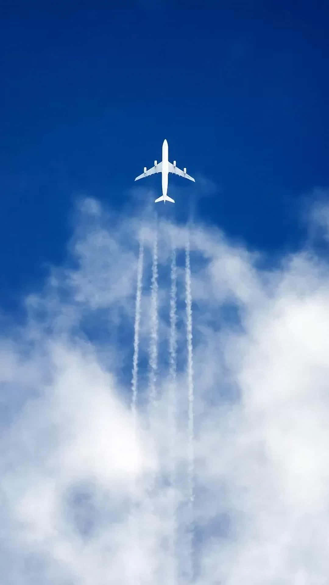 Flugzeughinterlässt Vier Rauchspuren - Hintergrundbild Für Android