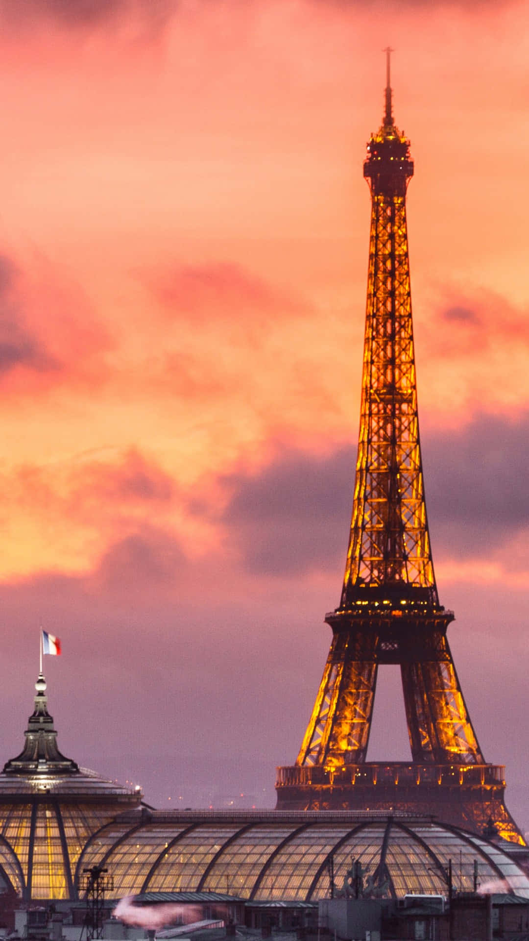 Eiffeltornetsom Lyser I Orange Android Resebakgrund.