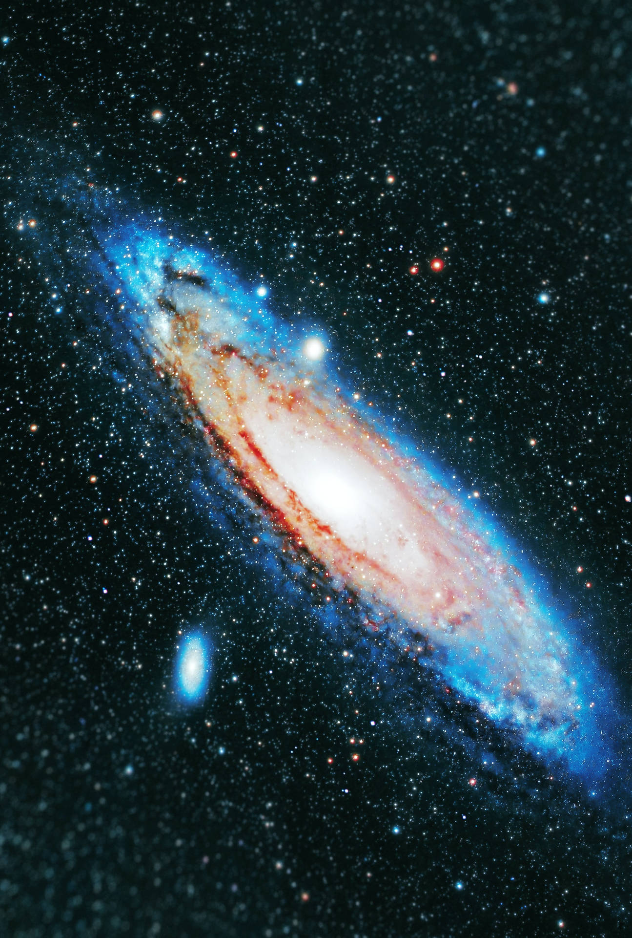 Breathtaking View of the Star-Studded Andromeda Galaxy Wallpaper