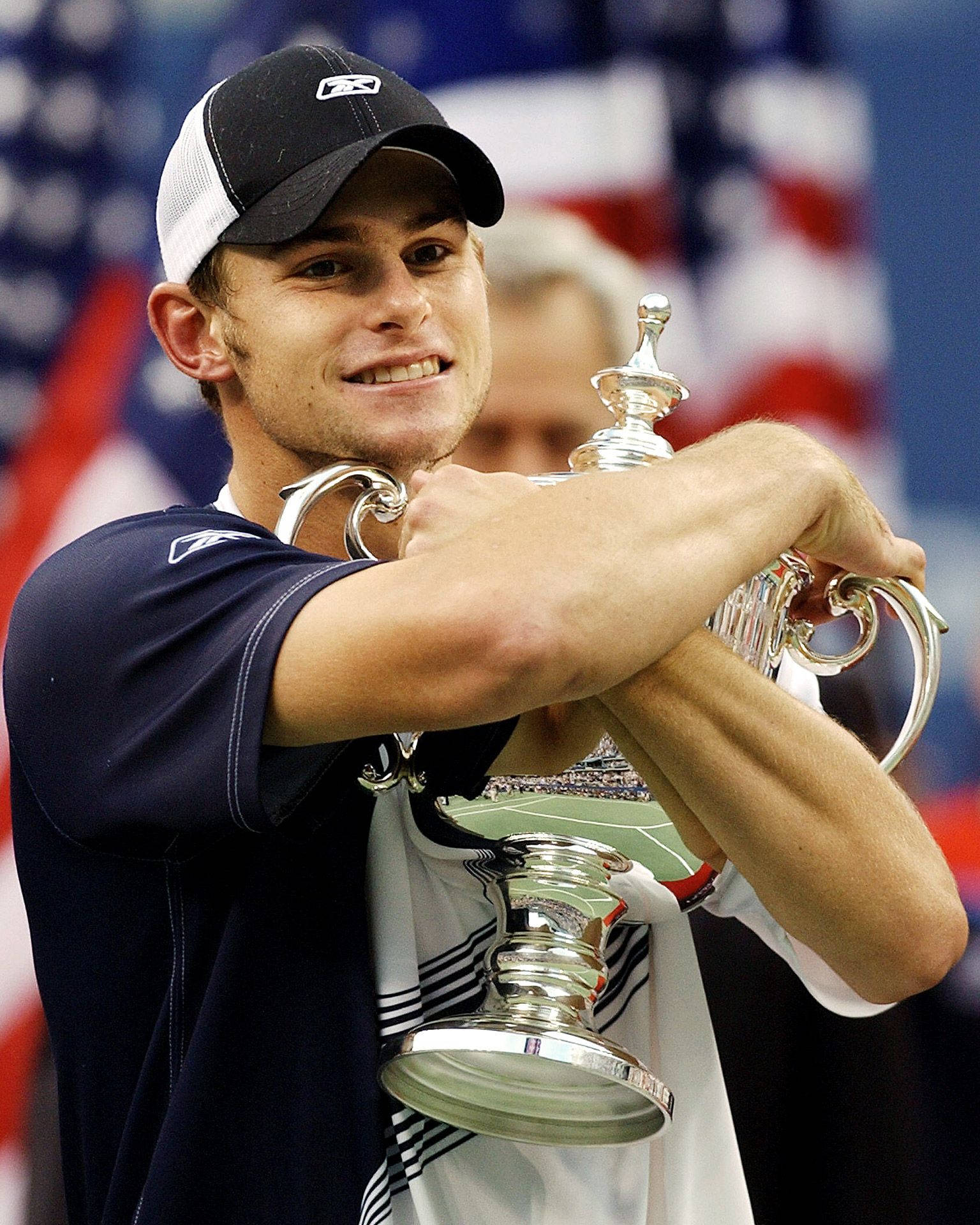 Andy Roddick Holding the 2003 US Open Tennis Trophy Wallpaper