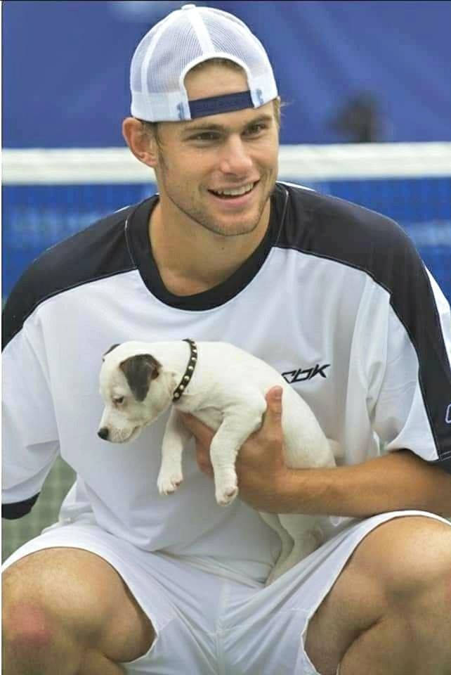 Andy Roddick Holding White Puppie Wallpaper