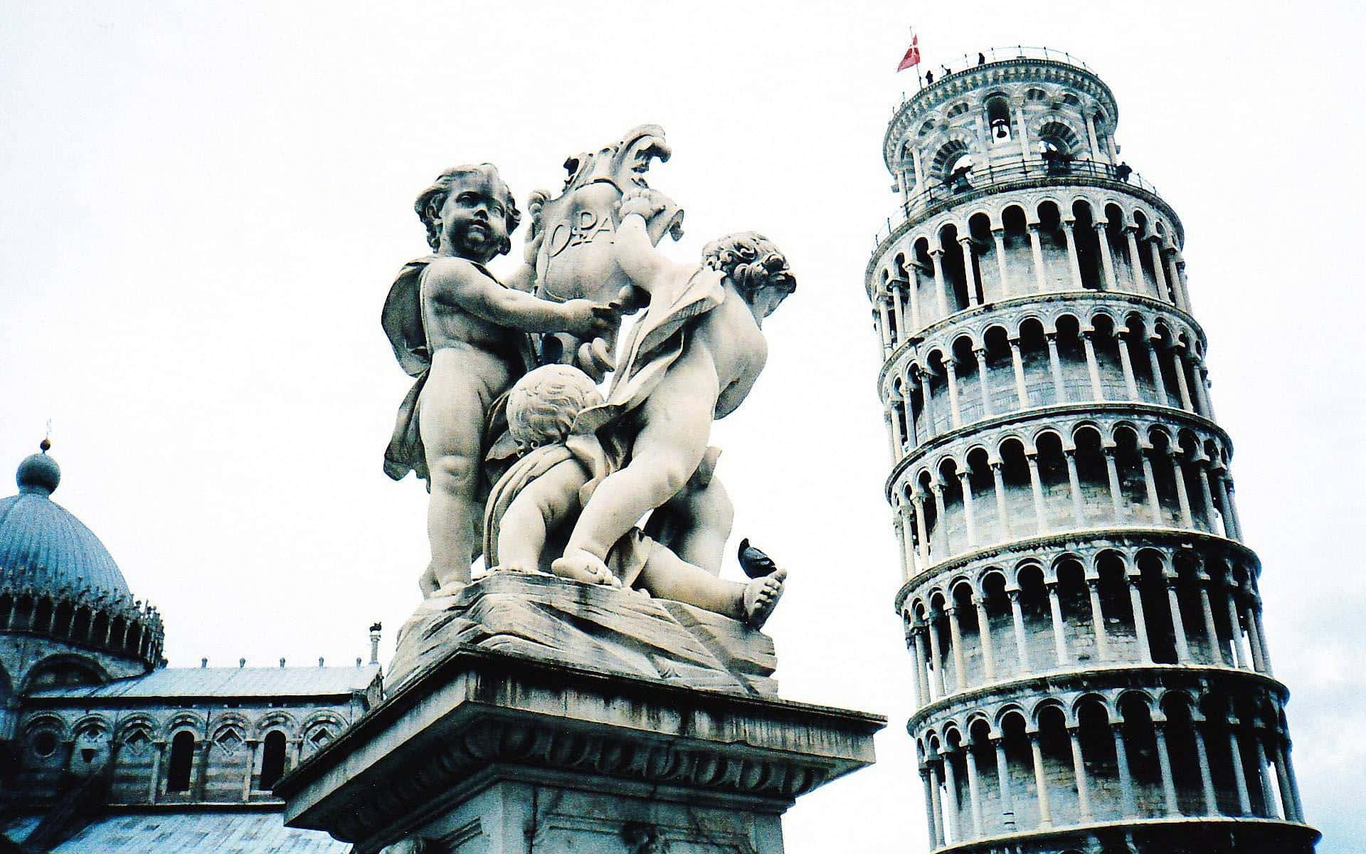 Angel Statue Near Tower Of Pisa Wallpaper