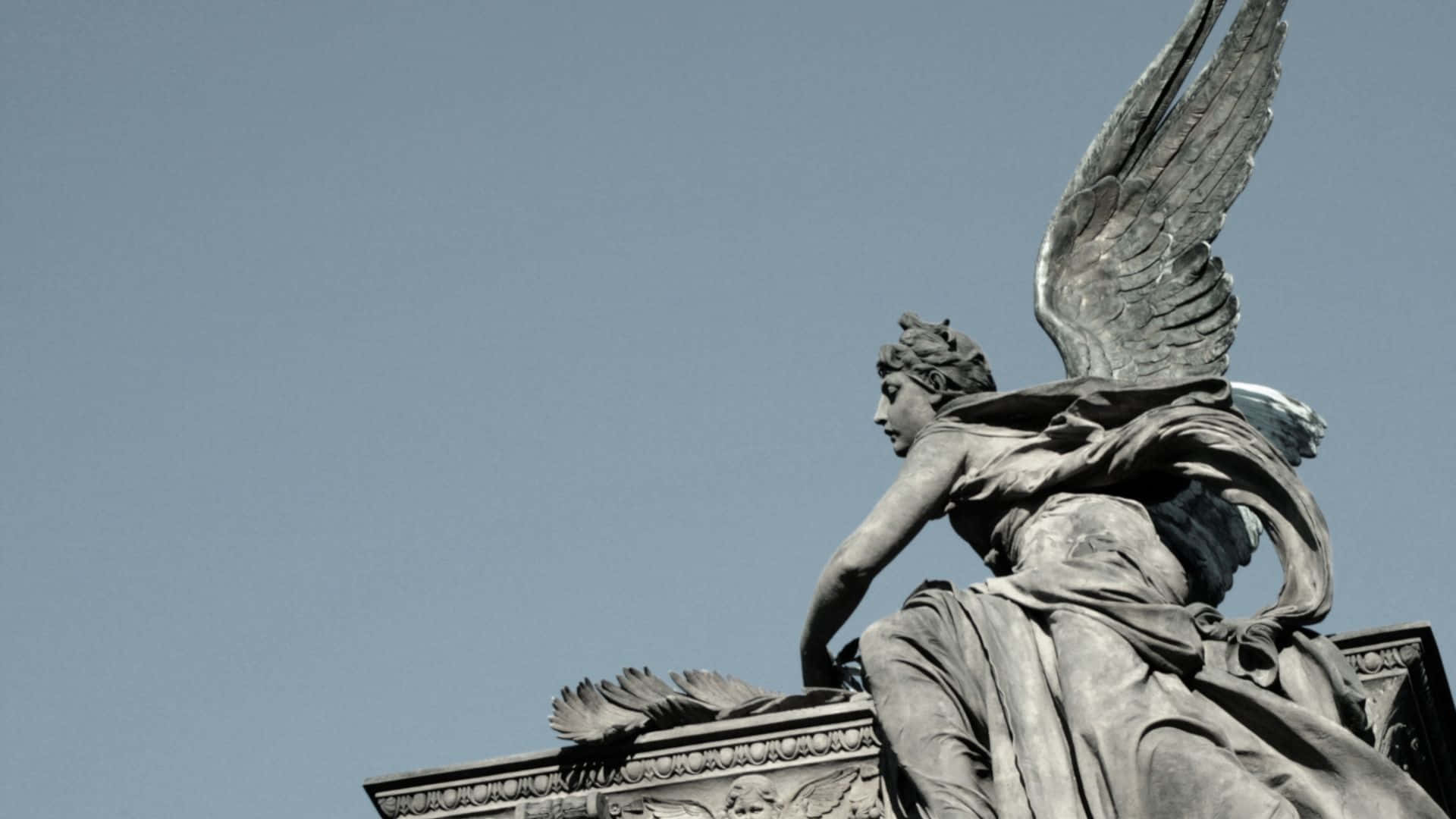 Angel Statue Profile Against Sky Wallpaper