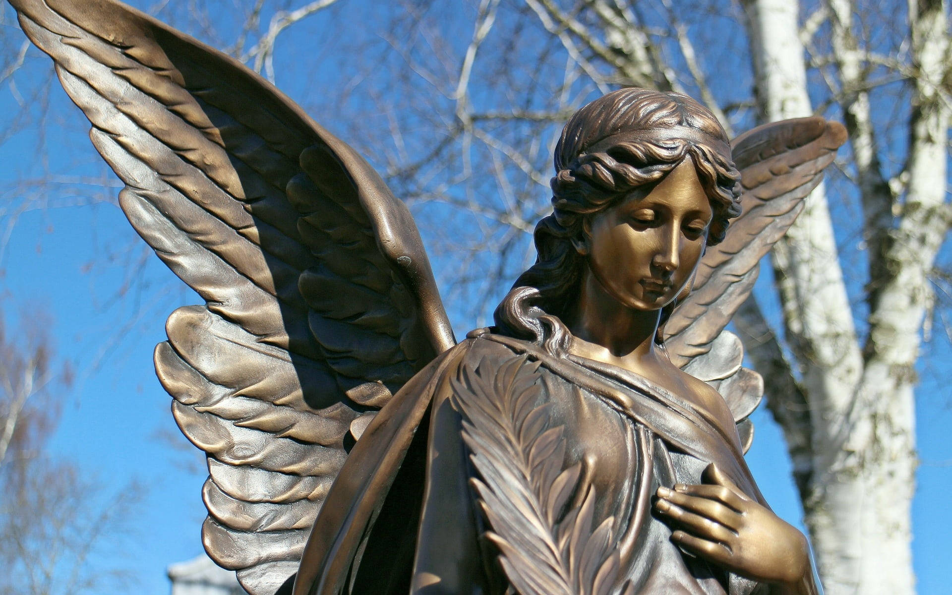 Engel statue med åbne vinger Wallpaper