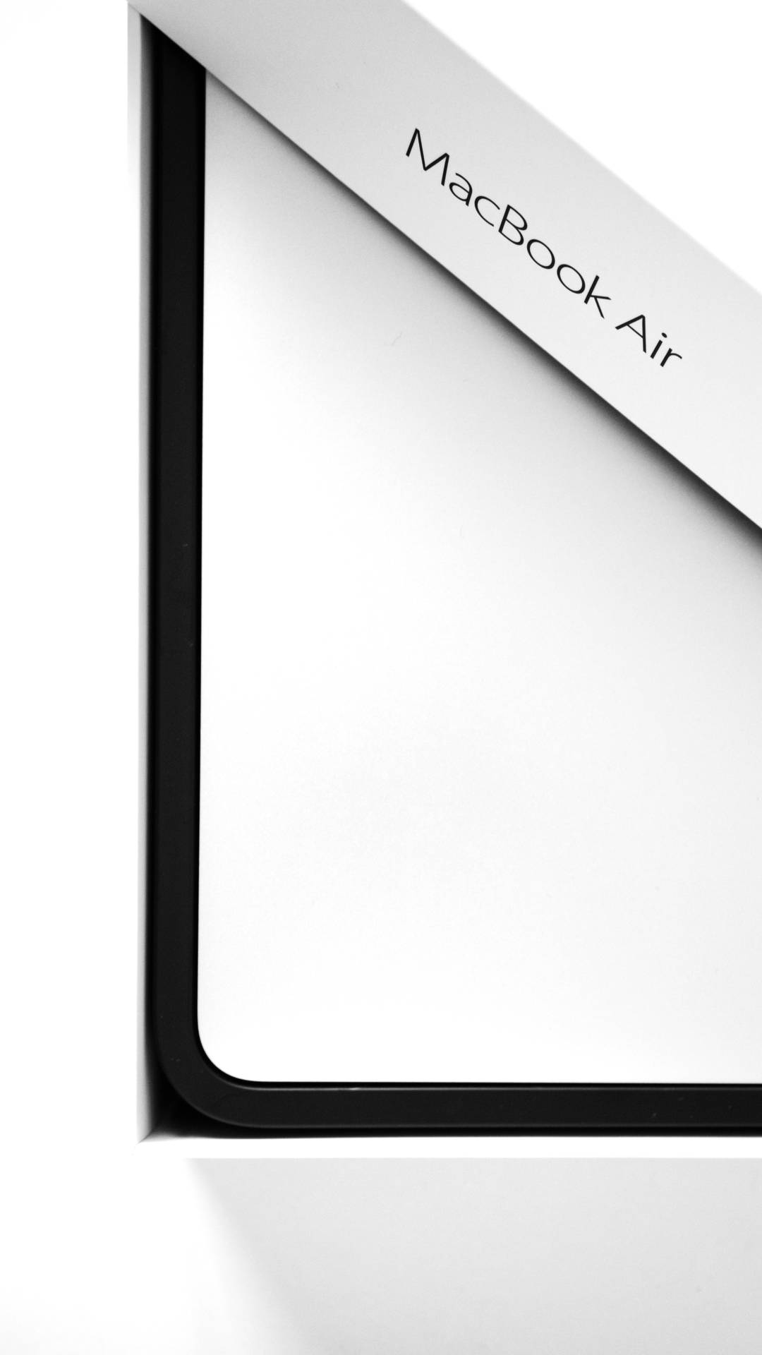 Angled View Of Macbook Air 2020 Box Wallpaper