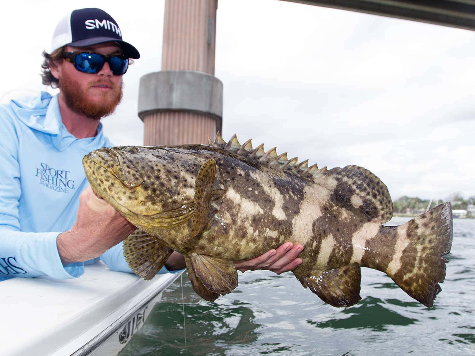 Angler Holding Goliath Grouper Wallpaper