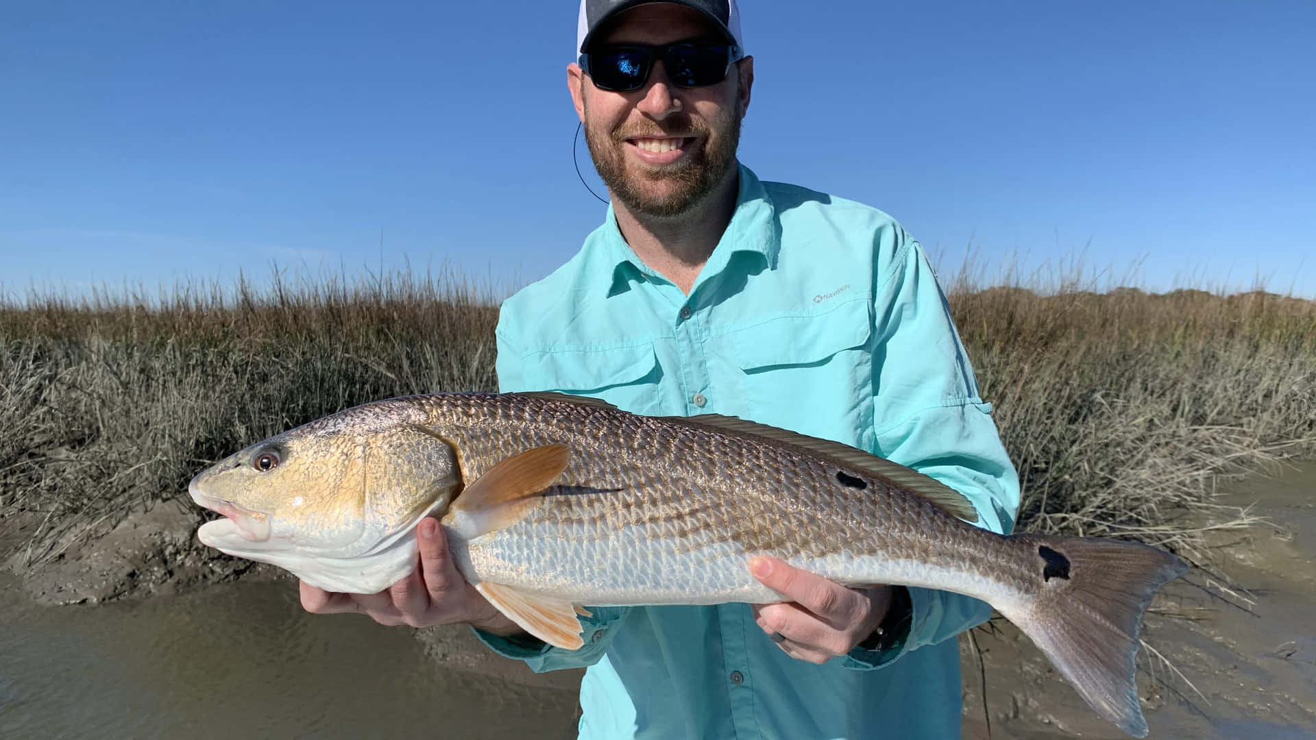 Anglerwith Caught Redfish Wallpaper