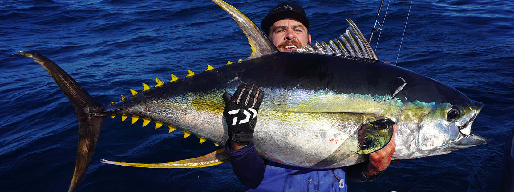 Anglerwith Large Yellowfin Tuna Catch Wallpaper
