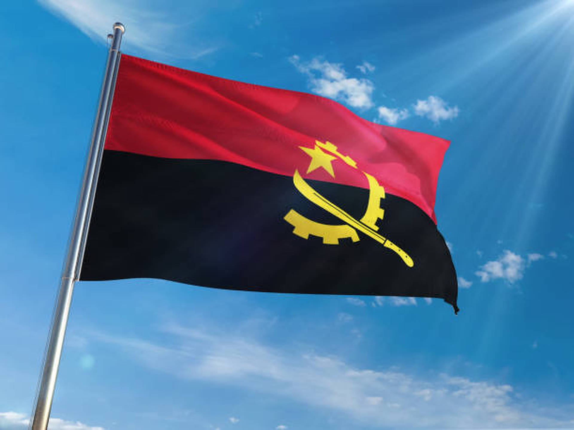 Download Angola Flag Low Angle Wallpaper