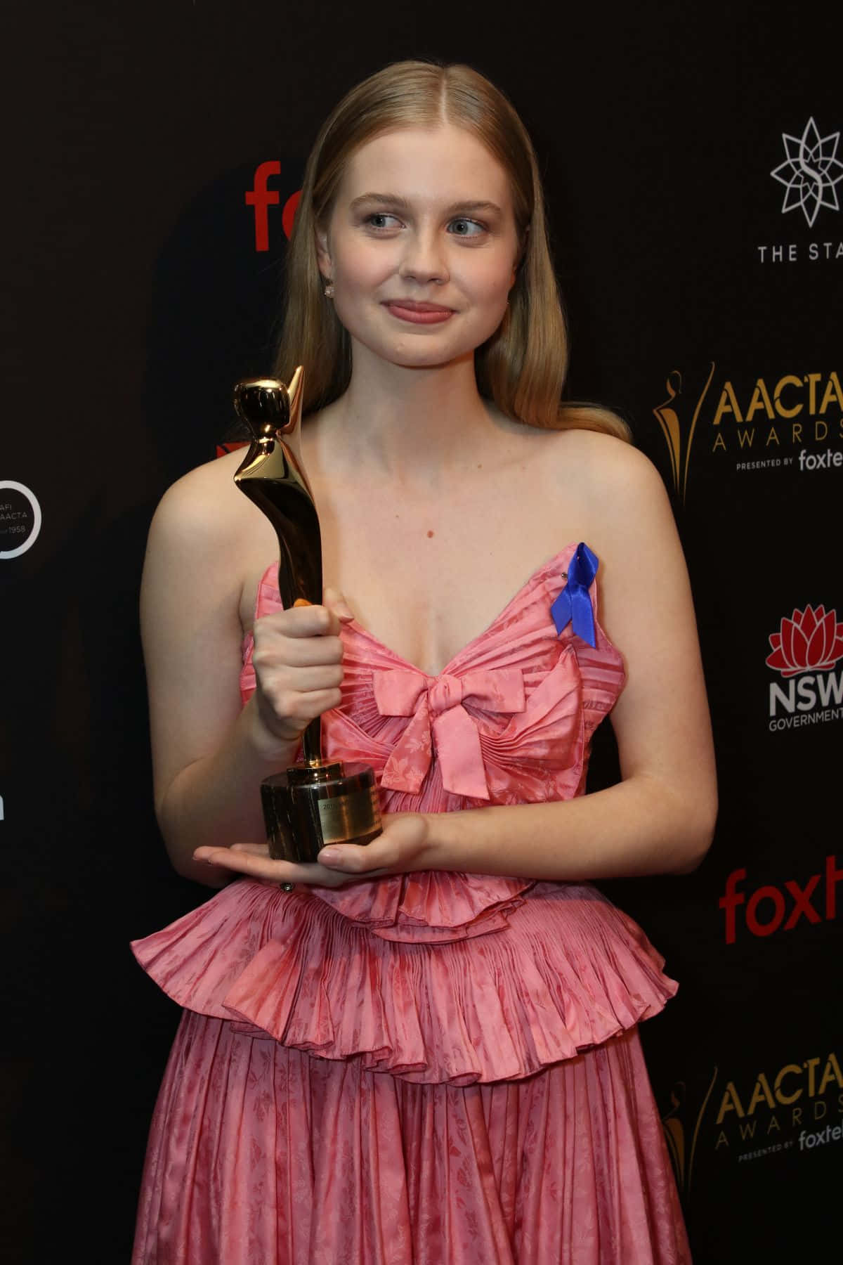 Download Angourie Rice Award Winner Pose Wallpaper | Wallpapers.com