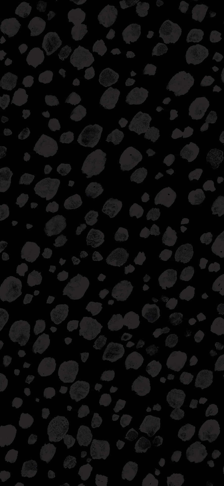 Black And White Pebbles On A Black Background Wallpaper
