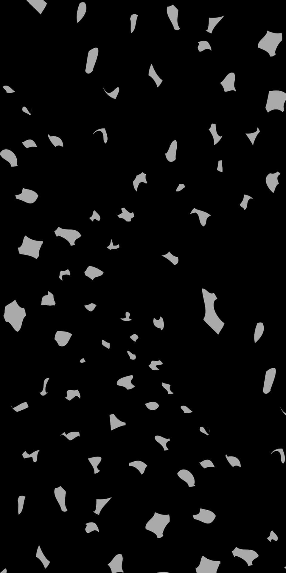 A Black And White Image Of Confetti Falling From The Sky Wallpaper