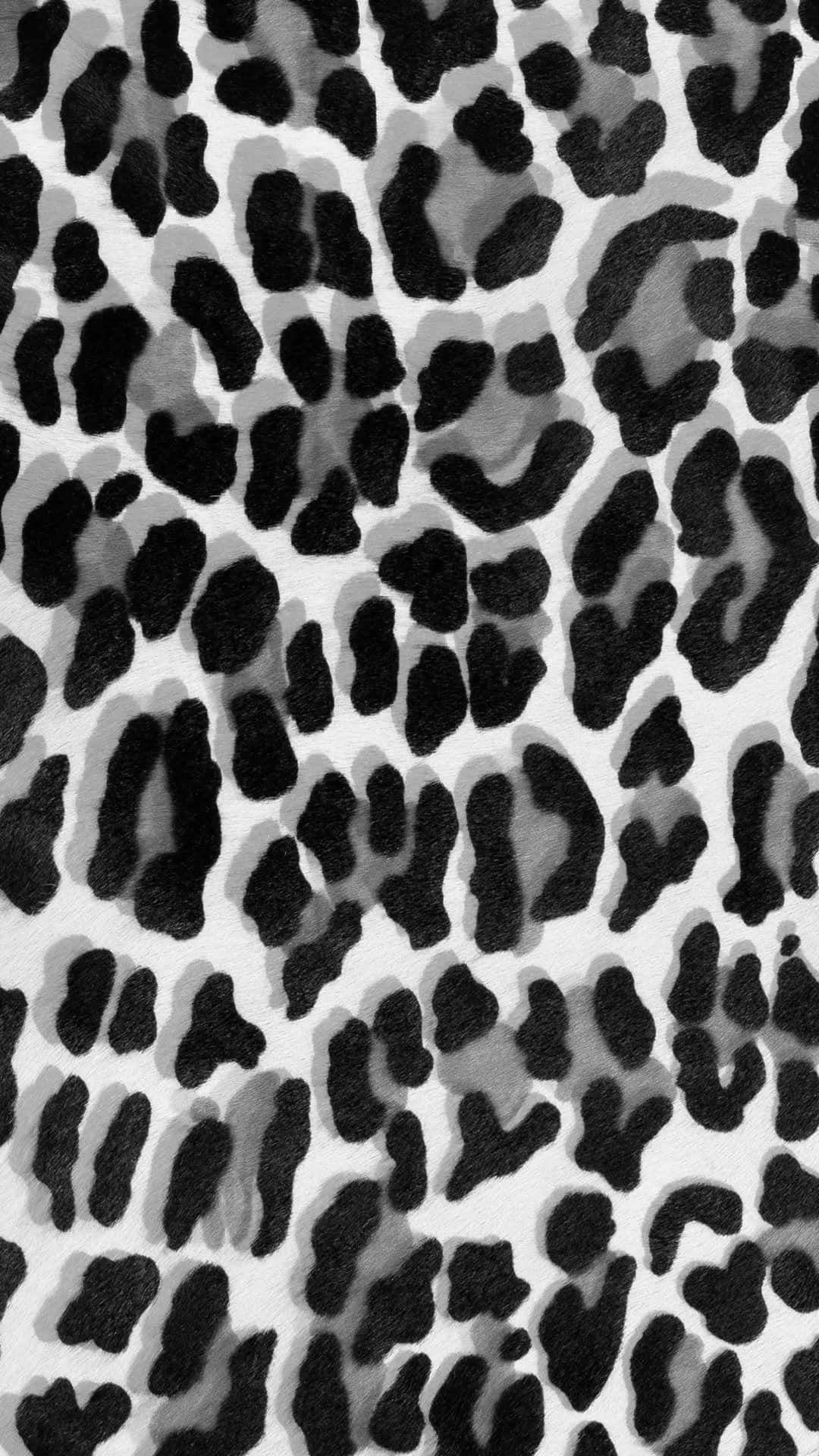 A Black And White Image Of A Leopard Print Wallpaper