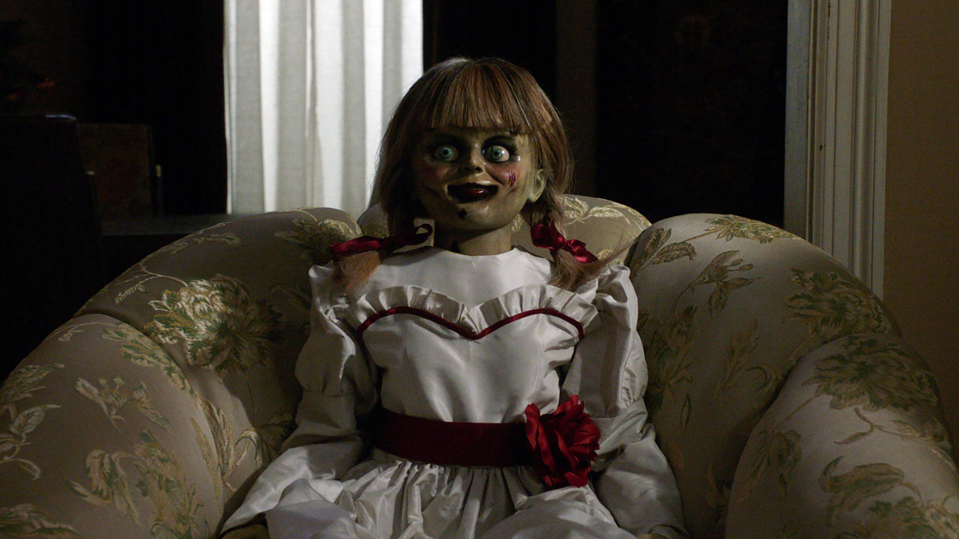 Annabelle Doll On Sofa Background