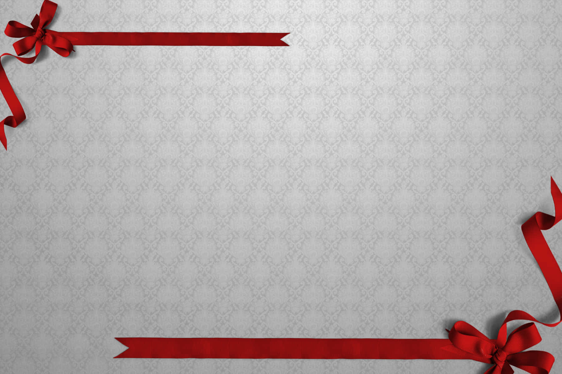 Red Ribbon And Bow On A Gray Background