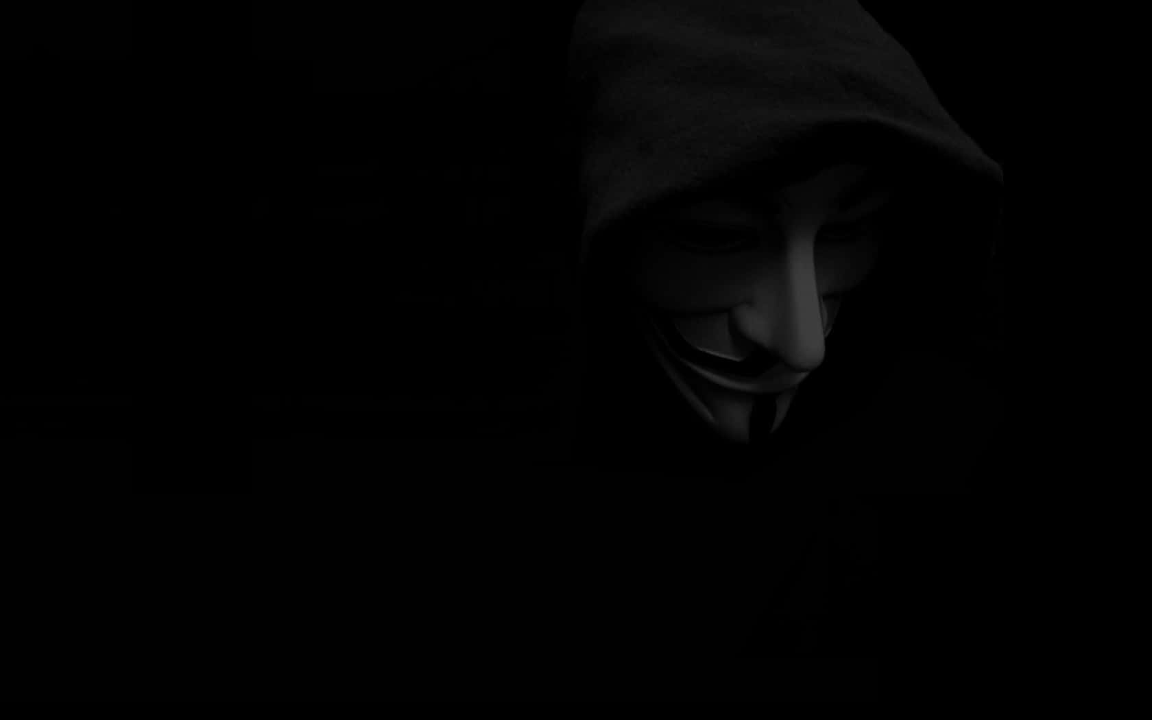 Anonymous figure in the dark, surrounded by matrix code