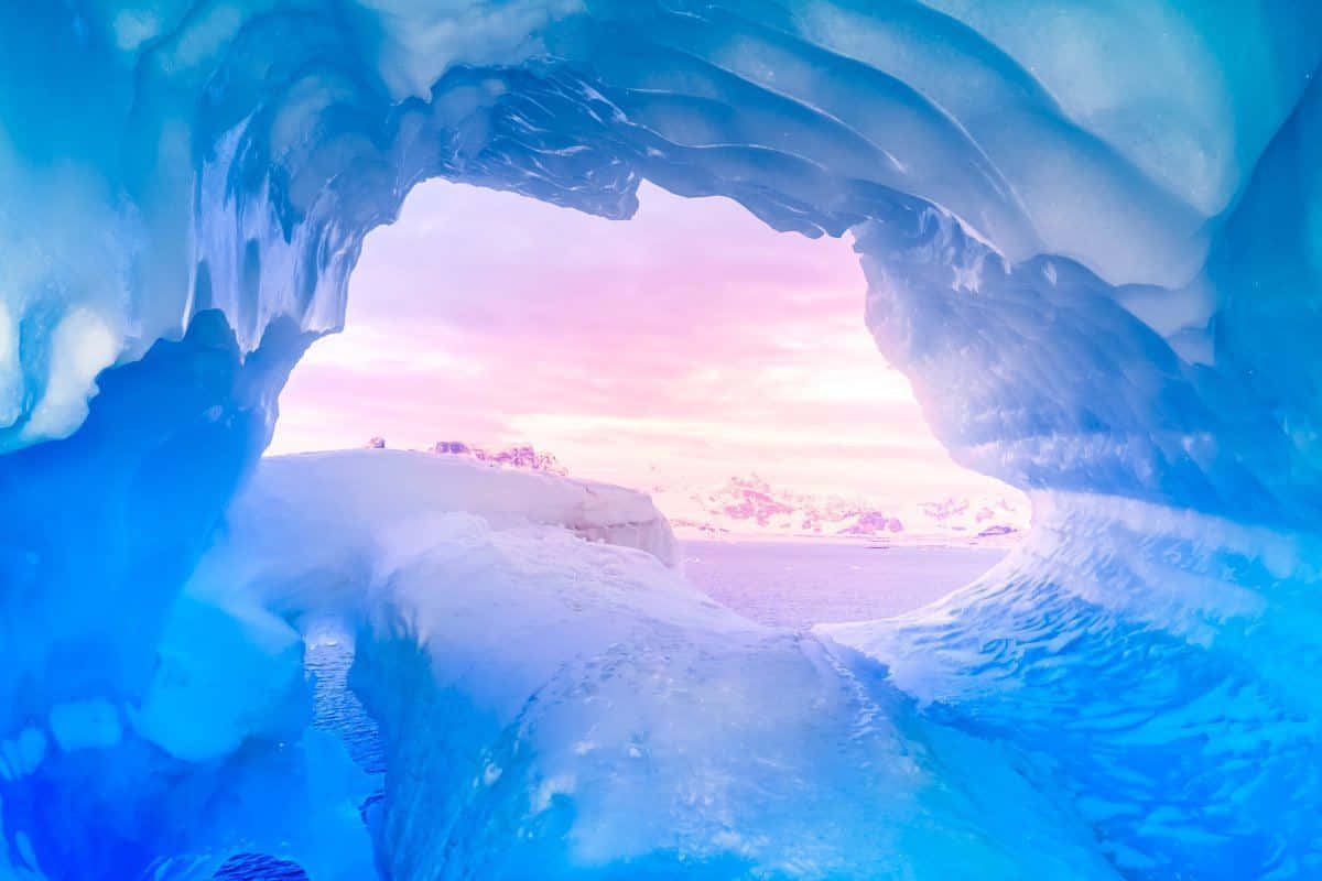 A Blue Ice Cave With A Blue Sky