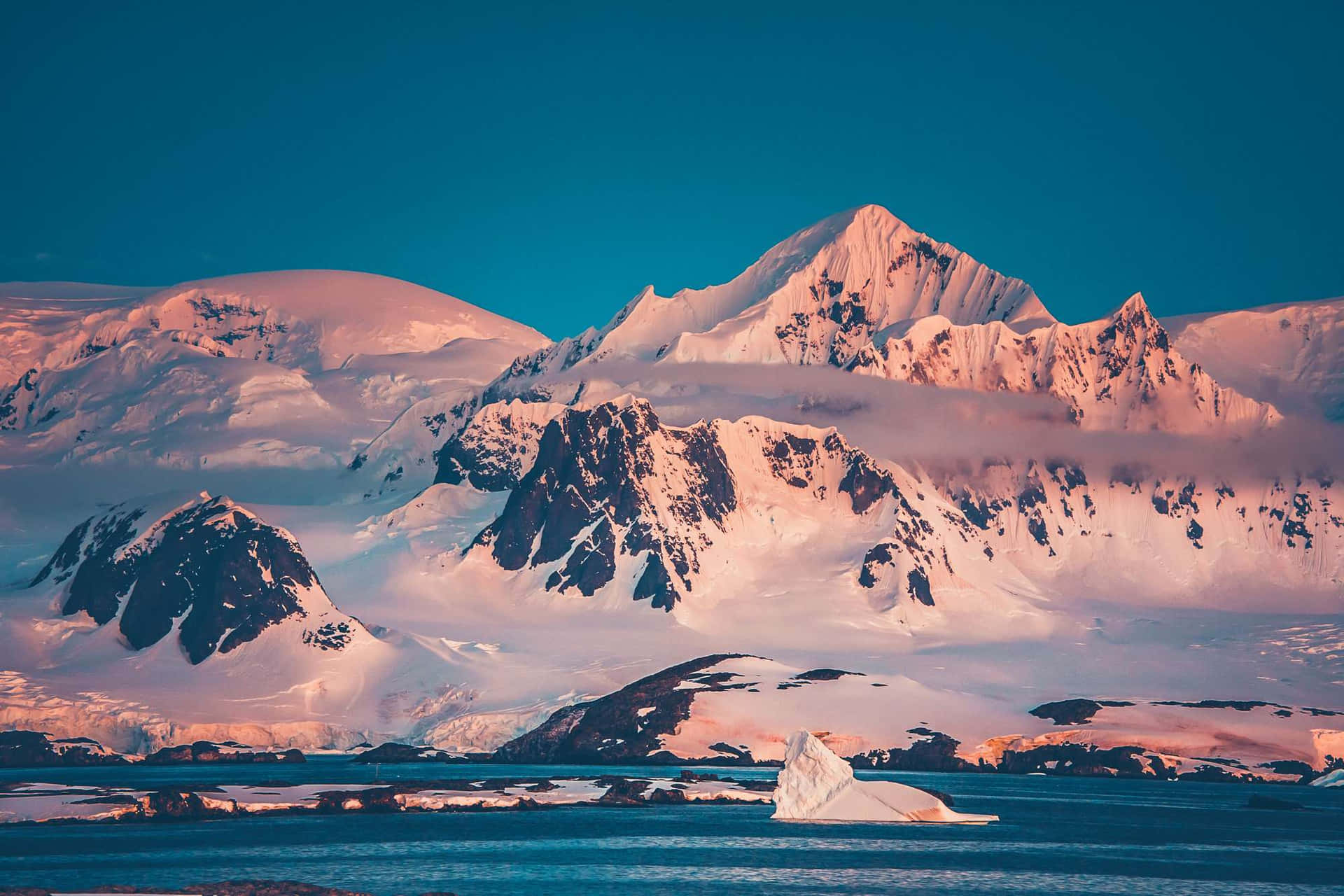 A Mountain Range With Snow And Ice In The Background