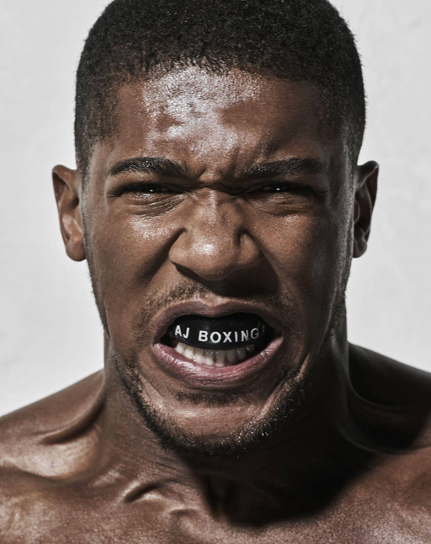Anthonyjoshua Aj Boxningsmunskydd (this Translation Is Specific To A Potential Wallpaper Design Featuring Anthony Joshua Wearing His Boxing Mouthguard) Wallpaper