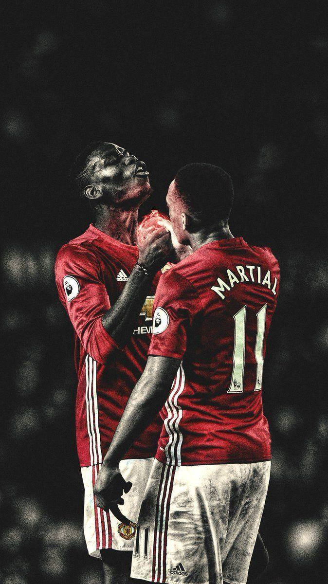 Anthony Martial Holding Hands Teammate Wallpaper