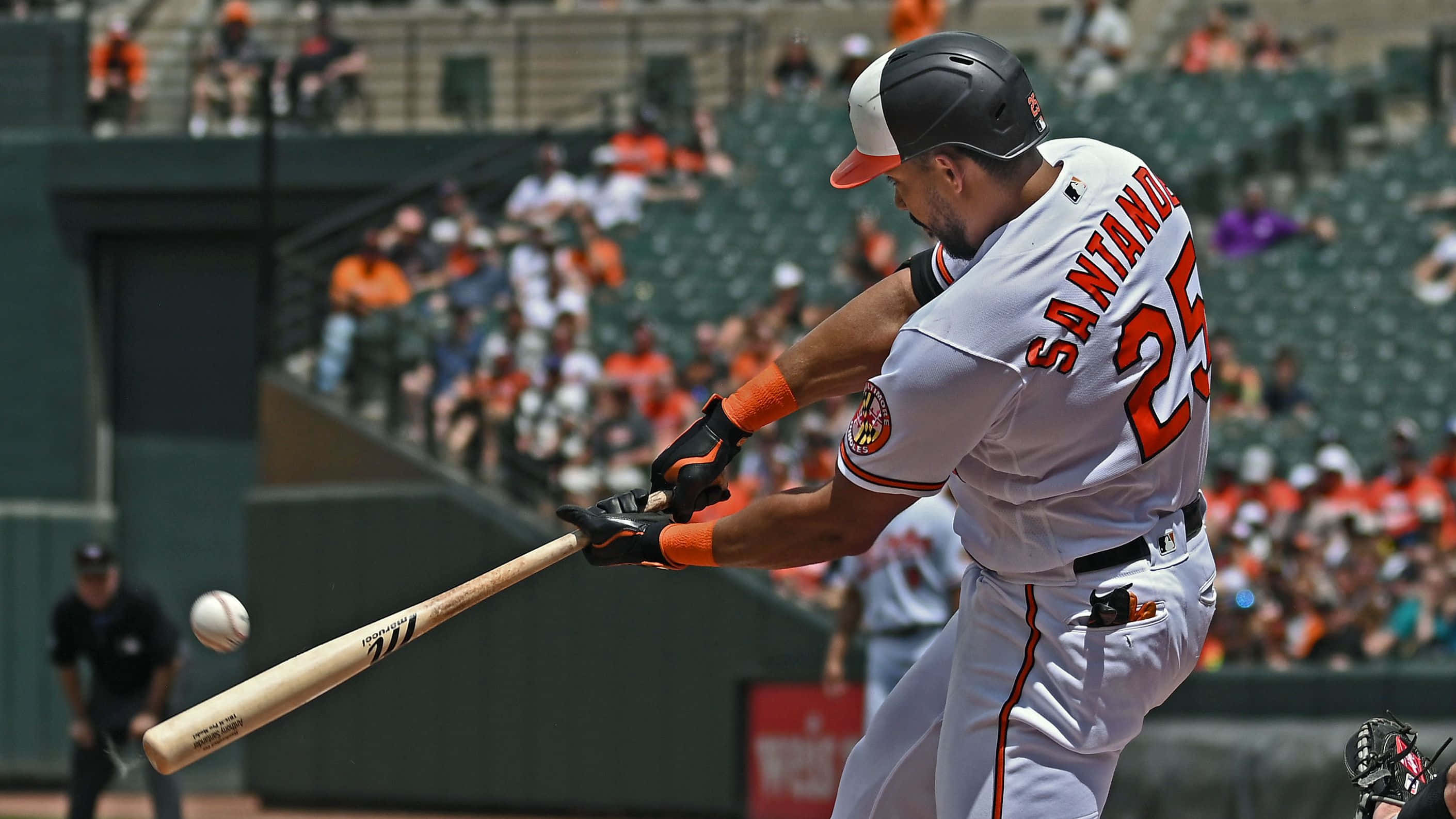 Anthony Santander Hits The Baseball During An Intense Game. Wallpaper