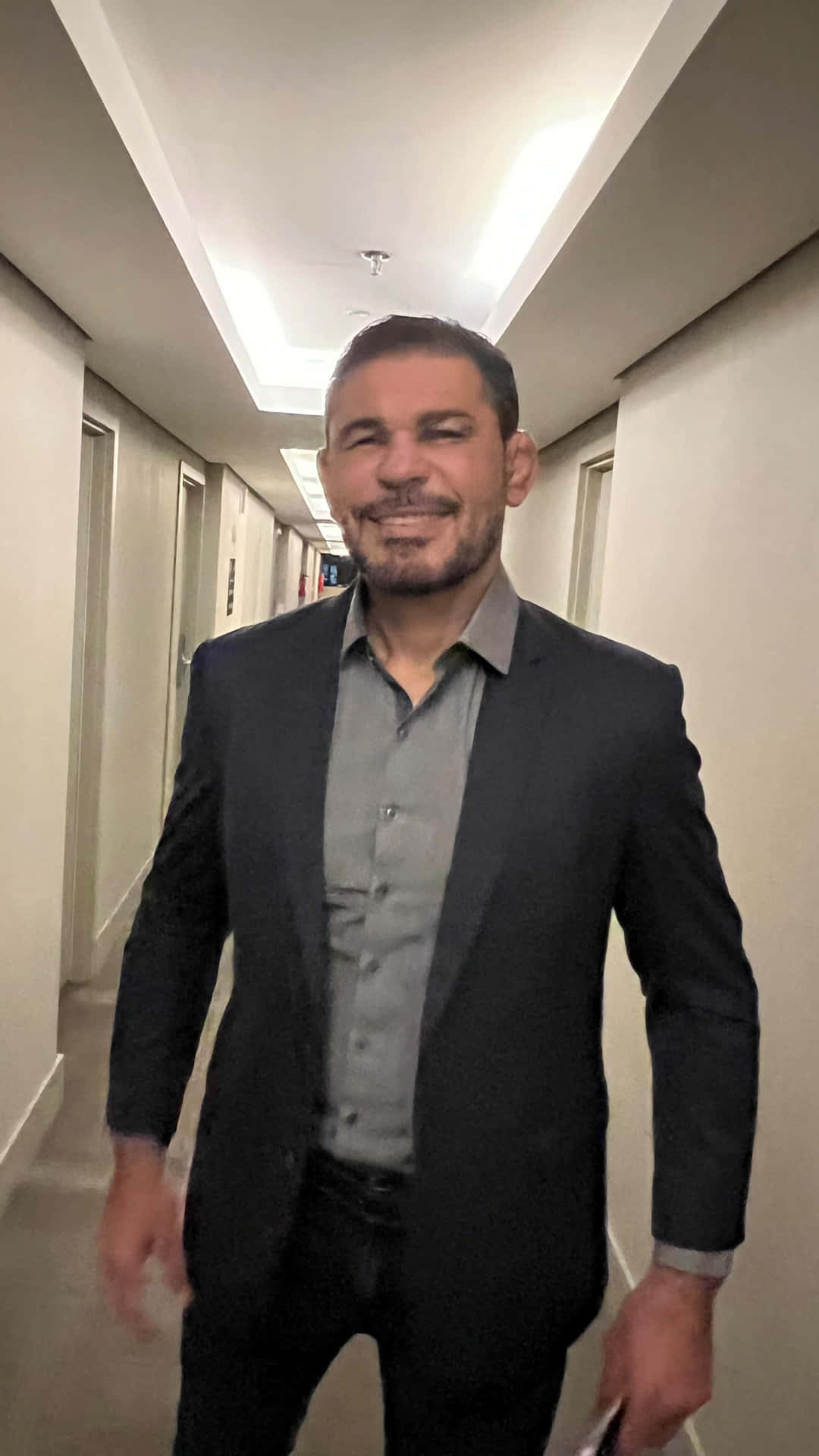 Distinguished MMA Fighter Antônio Rodrigo Nogueira in a Formal Suit Wallpaper