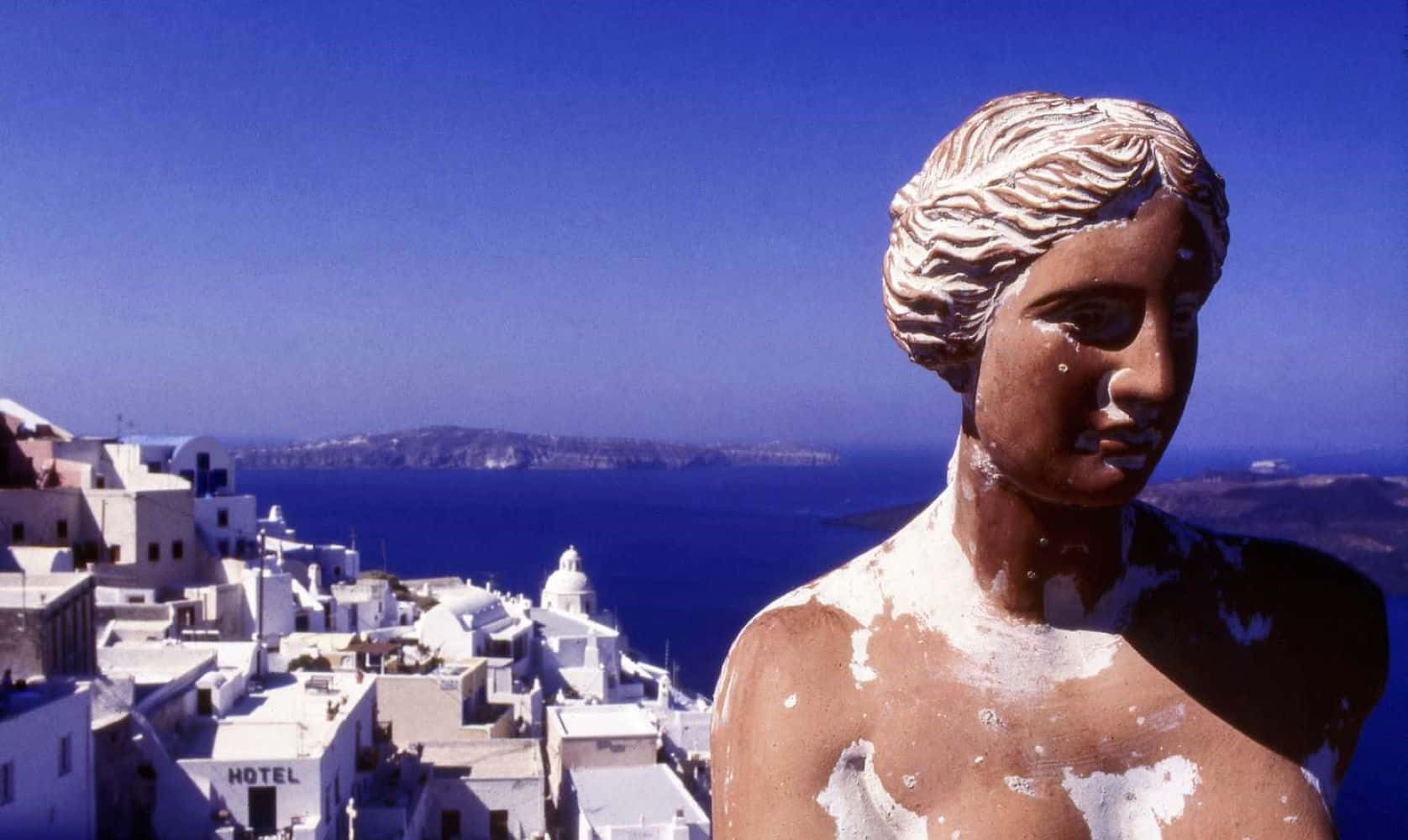 Aphrodite Statue Overlooking Santorini Wallpaper