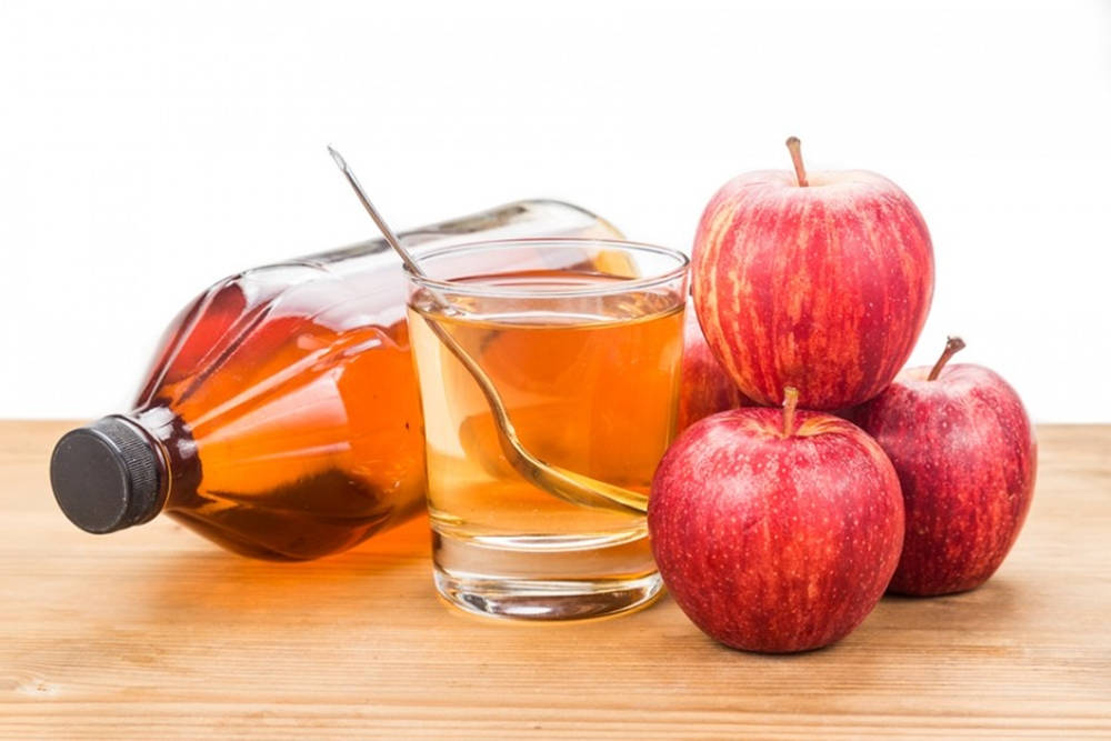 Apple Cider Vinegar Made From Fermented Apple Juice Background