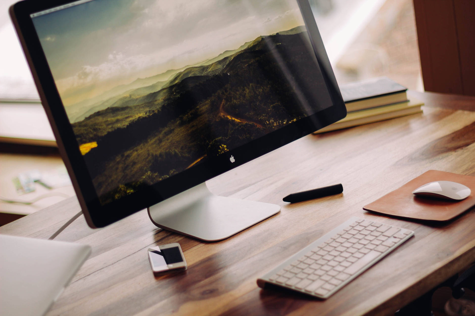 Apple Desktop On Wooden Office Desk Wallpaper