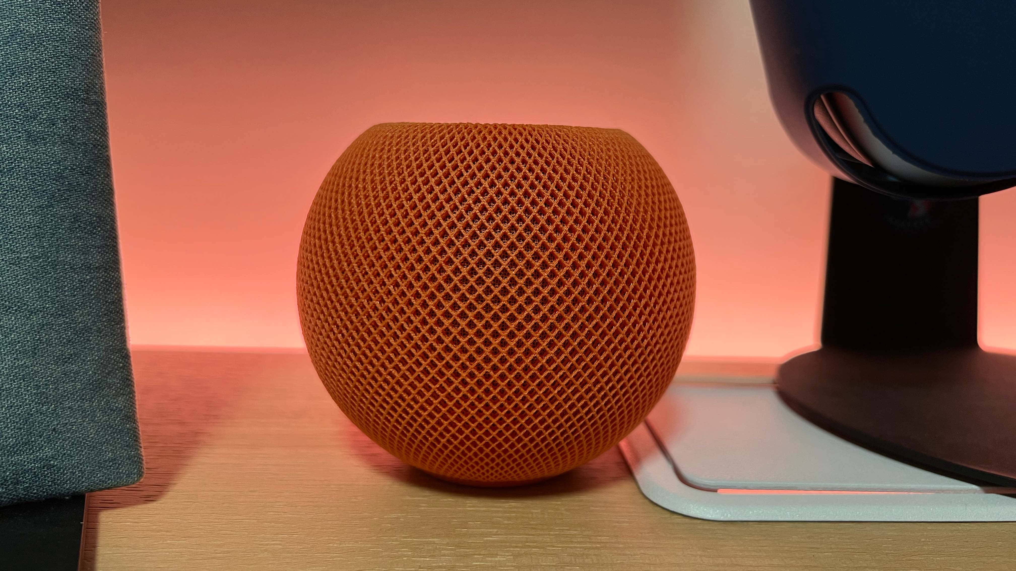 Apple Homepod On Wooden Table Wallpaper