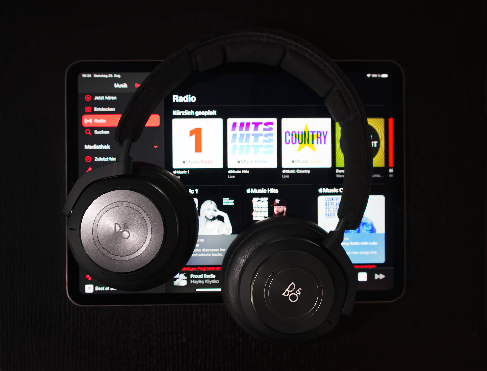 Apple Ipad Pro With Headphones Background