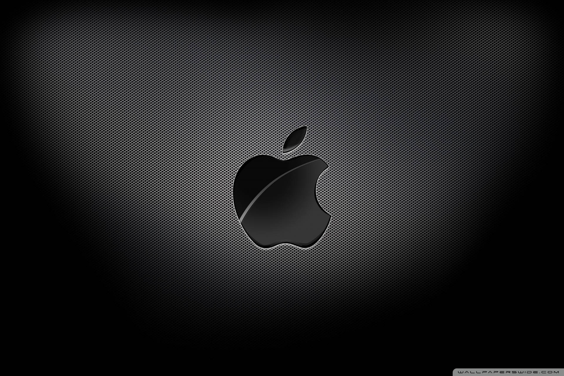 Intriguing display of Apple Logo in 4k resolution on a black carbon texture. Wallpaper