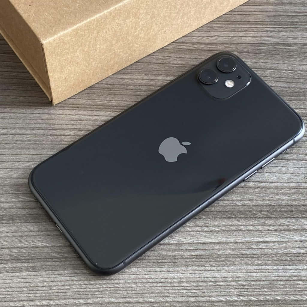 An Iphone 11 Pro Is Sitting On A Table