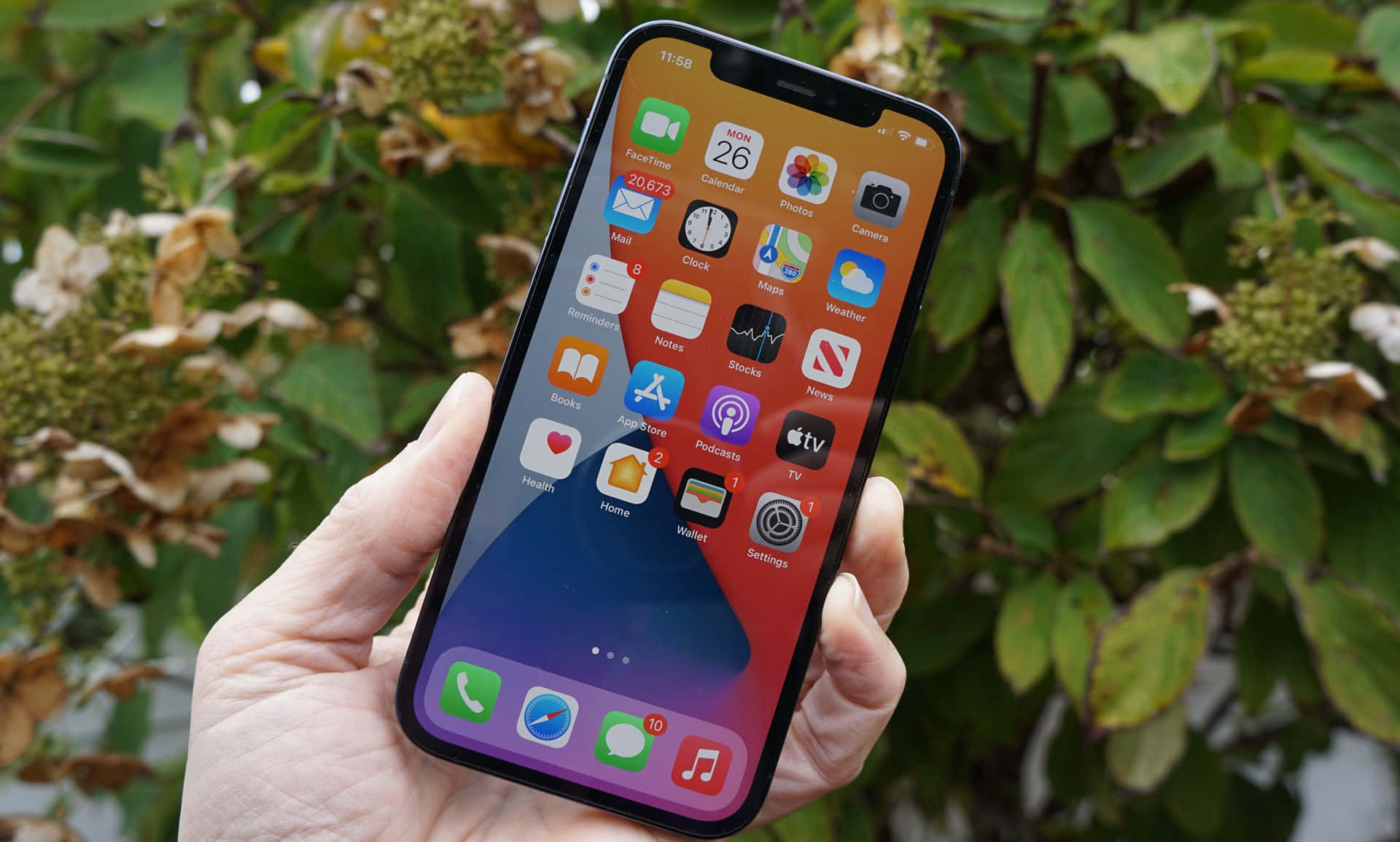 An Iphone Xr In A Hand With A Green Screen