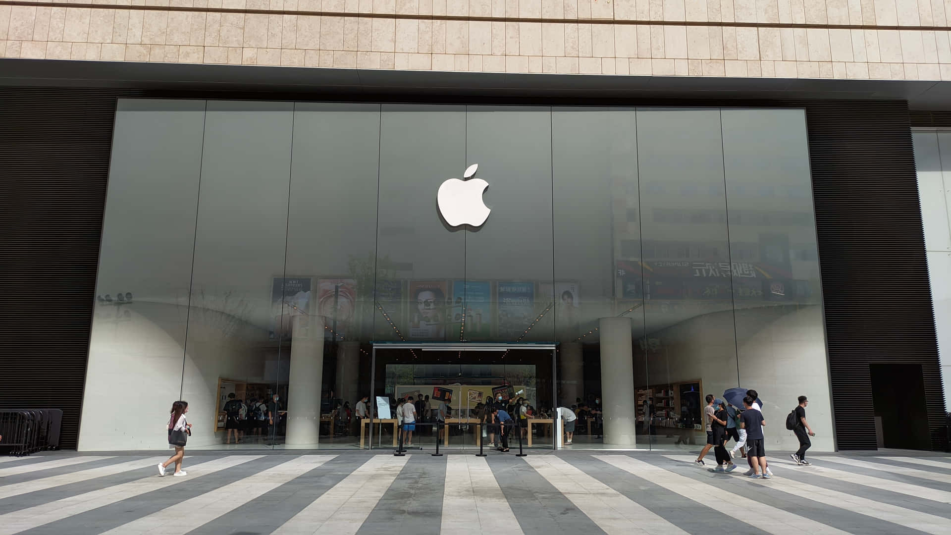 Apple Store Exteriorwith Pedestrians Wallpaper