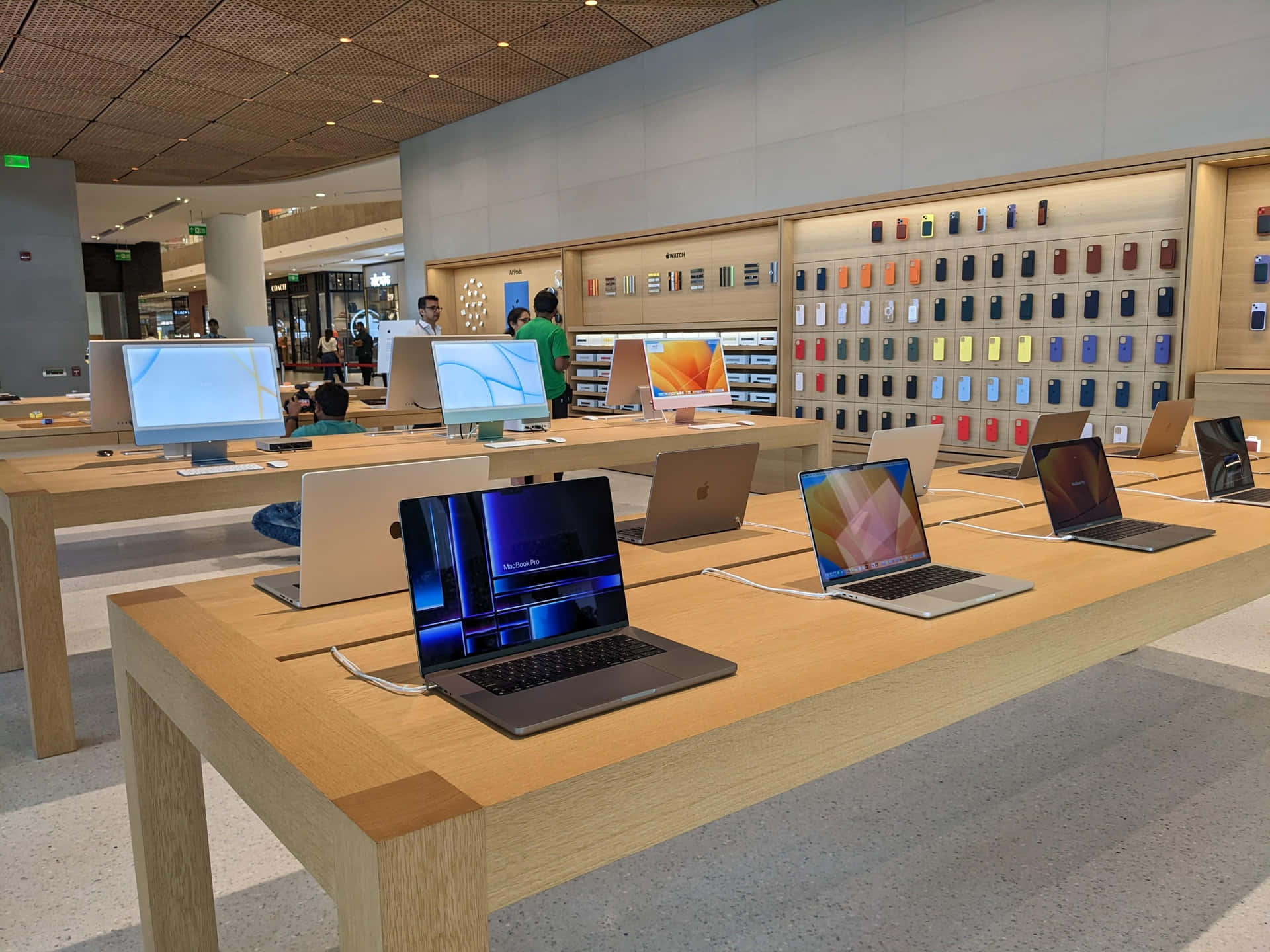 Apple Store Interiorwith Products Display Wallpaper