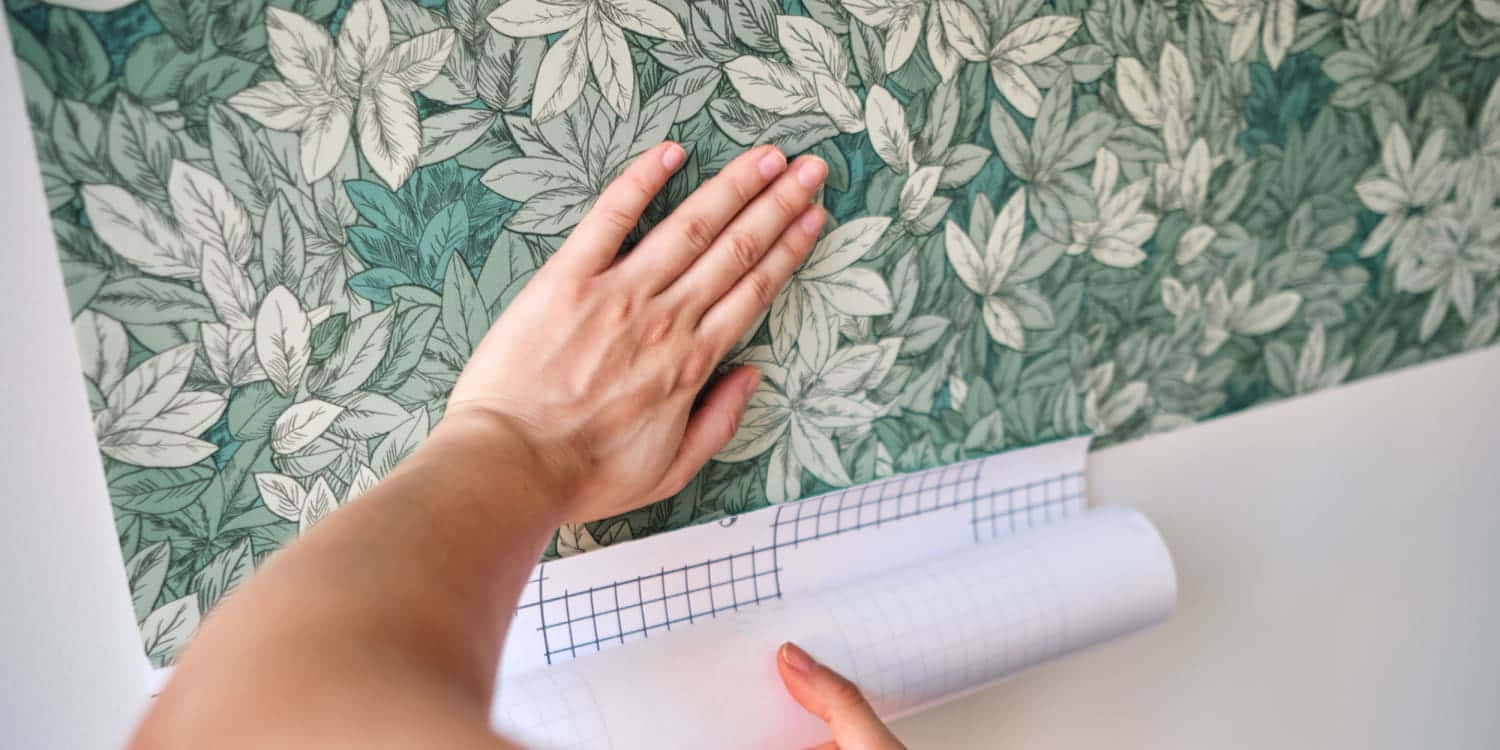 Applying Wallpaper With Wrist Visible Wallpaper