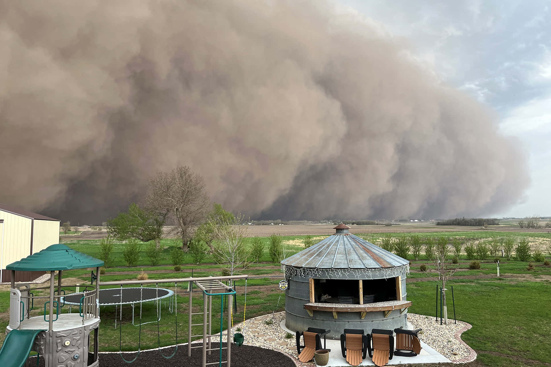 Approaching Dust Storm Over Residential Area Wallpaper