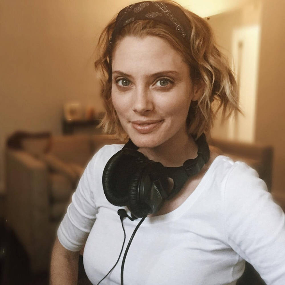 April Bowlby Wearing Headphones Wallpaper