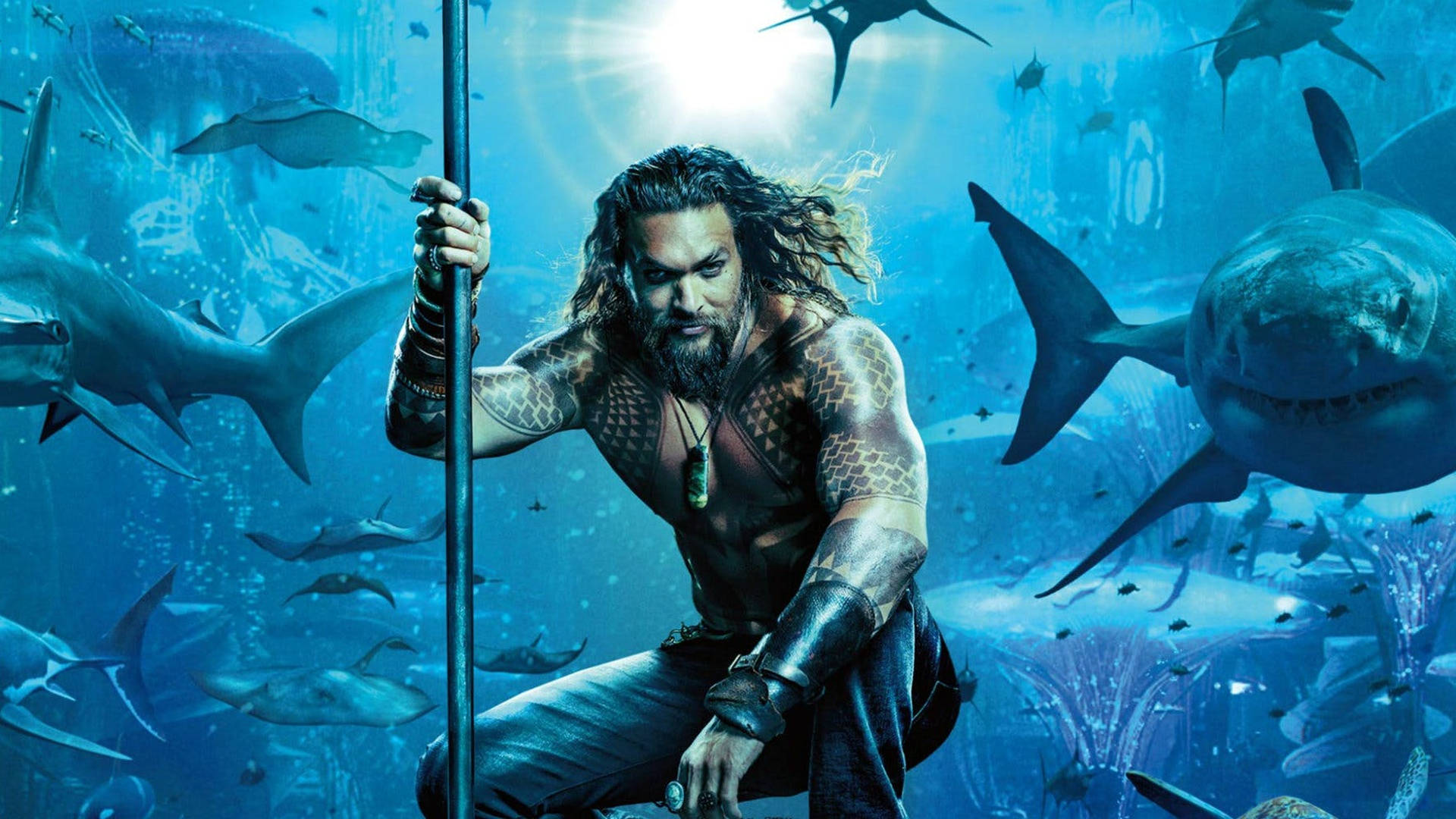 Aquaman Posing With Sharks Background