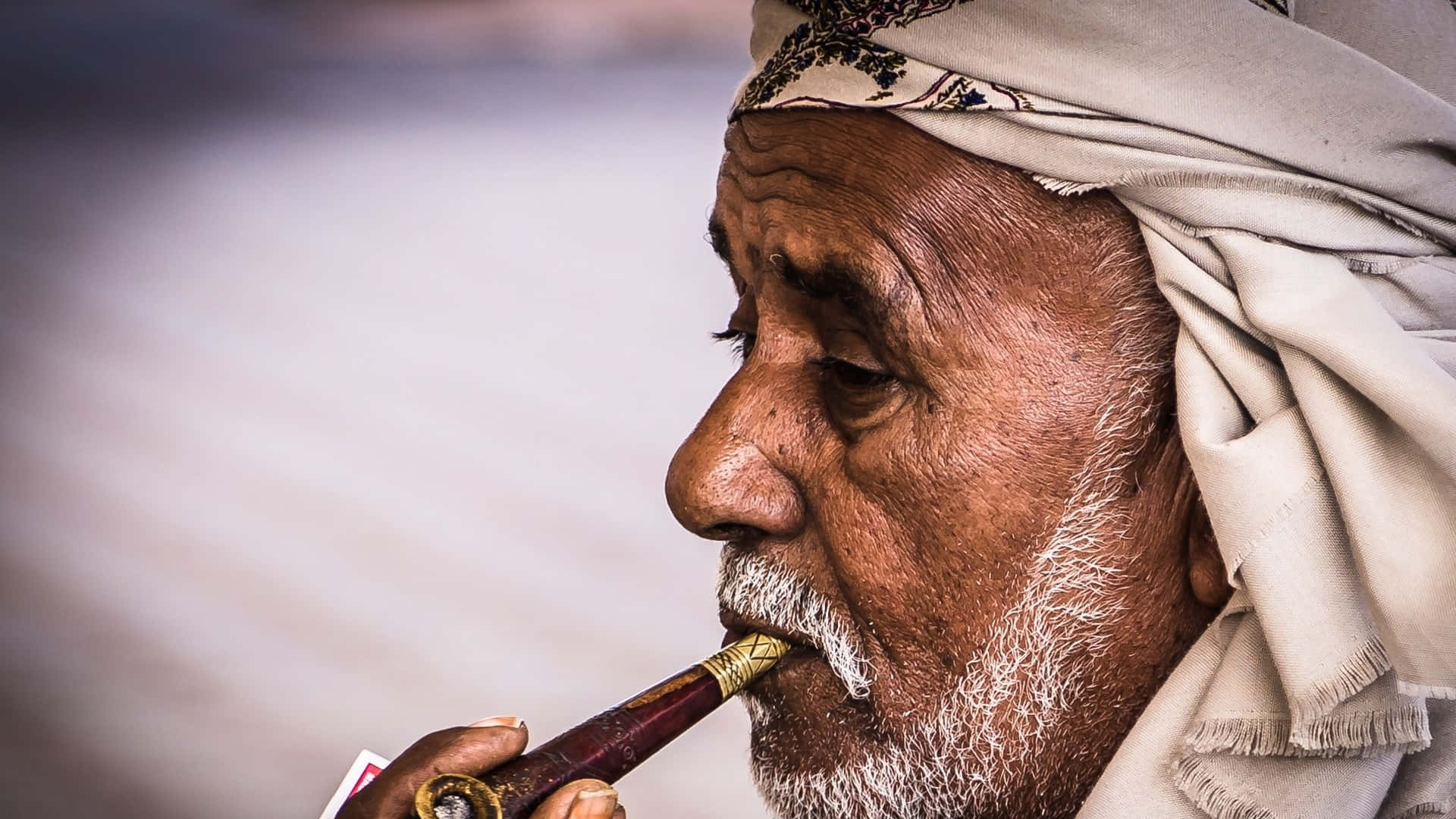 Arab Man Smoking Tobacco Pipe Wallpaper