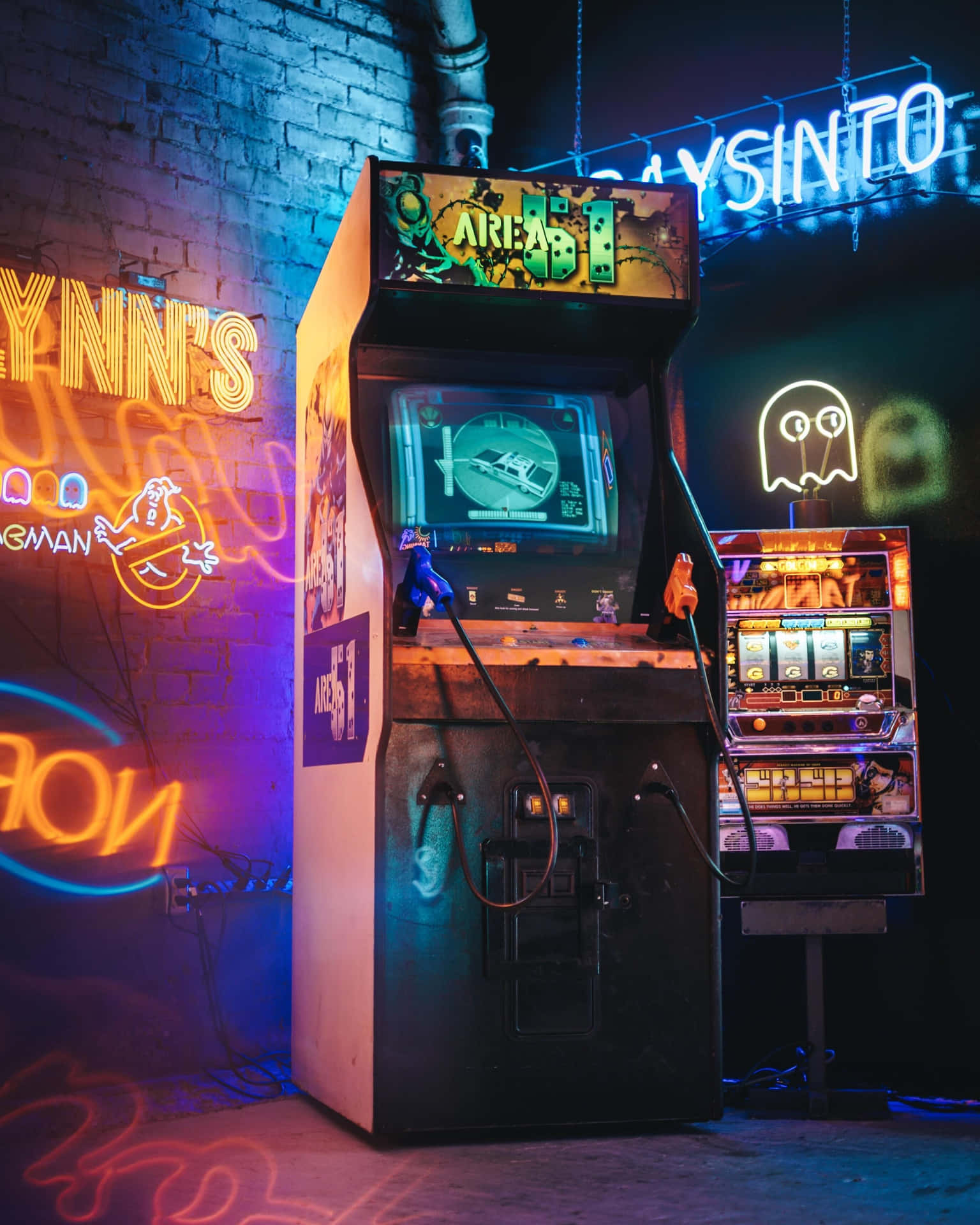 Immerse yourself in the vibrancy of an arcade space Wallpaper