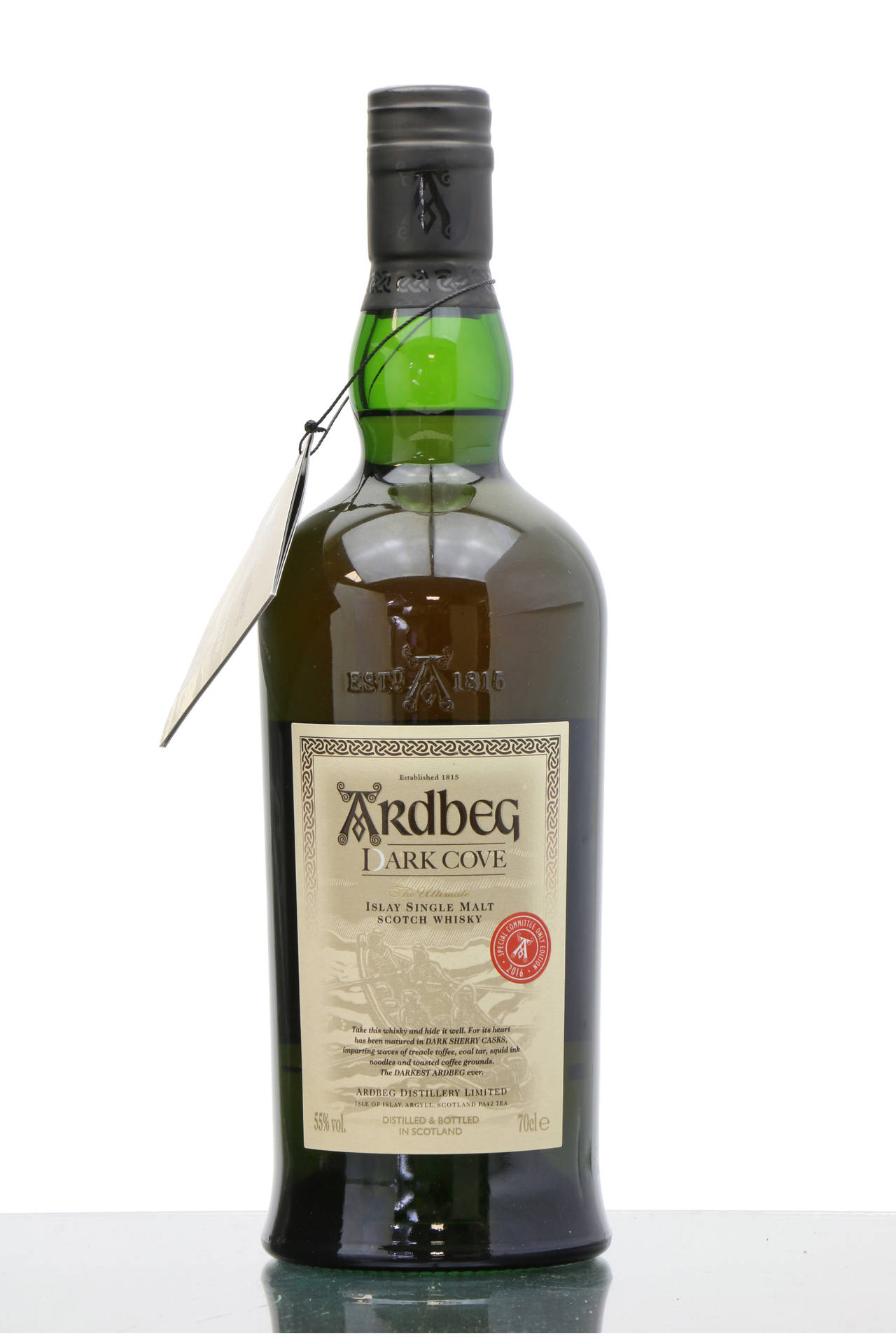 A Rich Blend of Tradition: Ardbeg Dark Cove Whisky Bottle with Tag Wallpaper