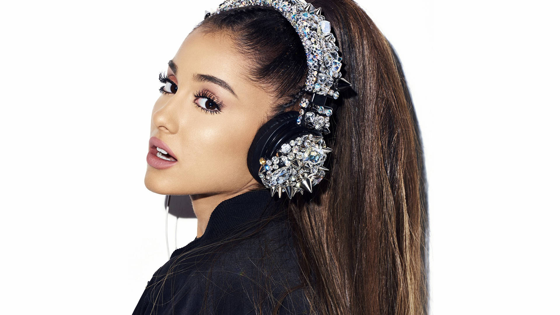 Ariana Grande looking perfect while rocking her silver diamond studs and headphones Wallpaper