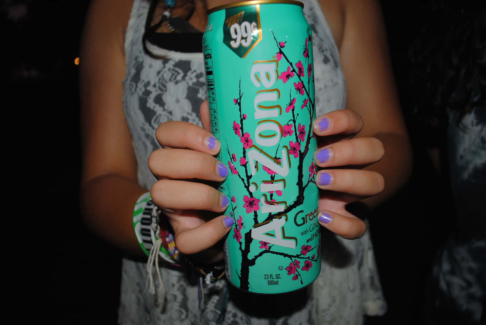 A Woman Holding A Can Of Arizona Beer Wallpaper