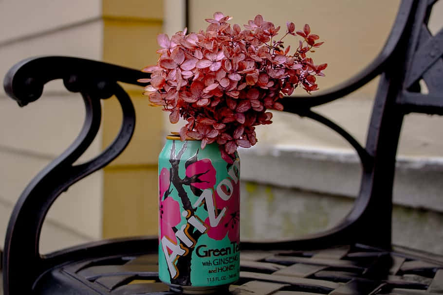 A Can Of Soda Sitting On A Bench Wallpaper