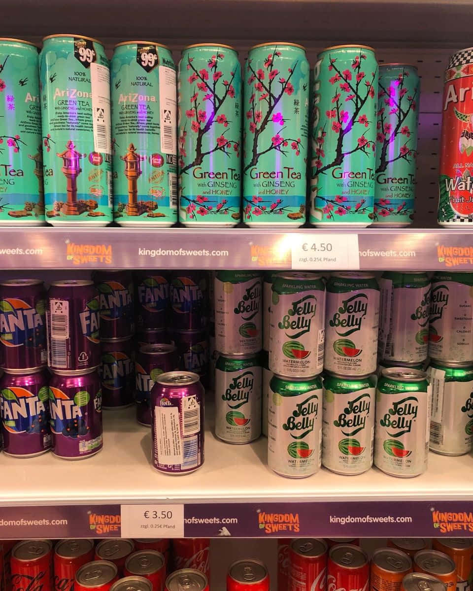 A Shelf Of Cans Of Soda Wallpaper